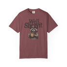 A maroon t-shirt featuring a graphic of a raccoon wearing a cowboy hat and holding a coffee mug.