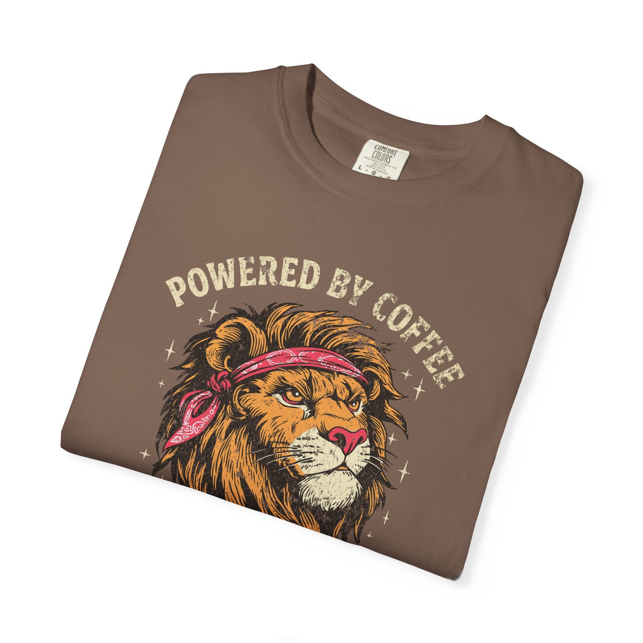 Brown t-shirt featuring a graphic of a lion wearing a red bandana with the text Powered by Coffee.