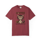 A maroon unisex t-shirt featuring a cute kitten holding a coffee mug with the text Coffee helps me.