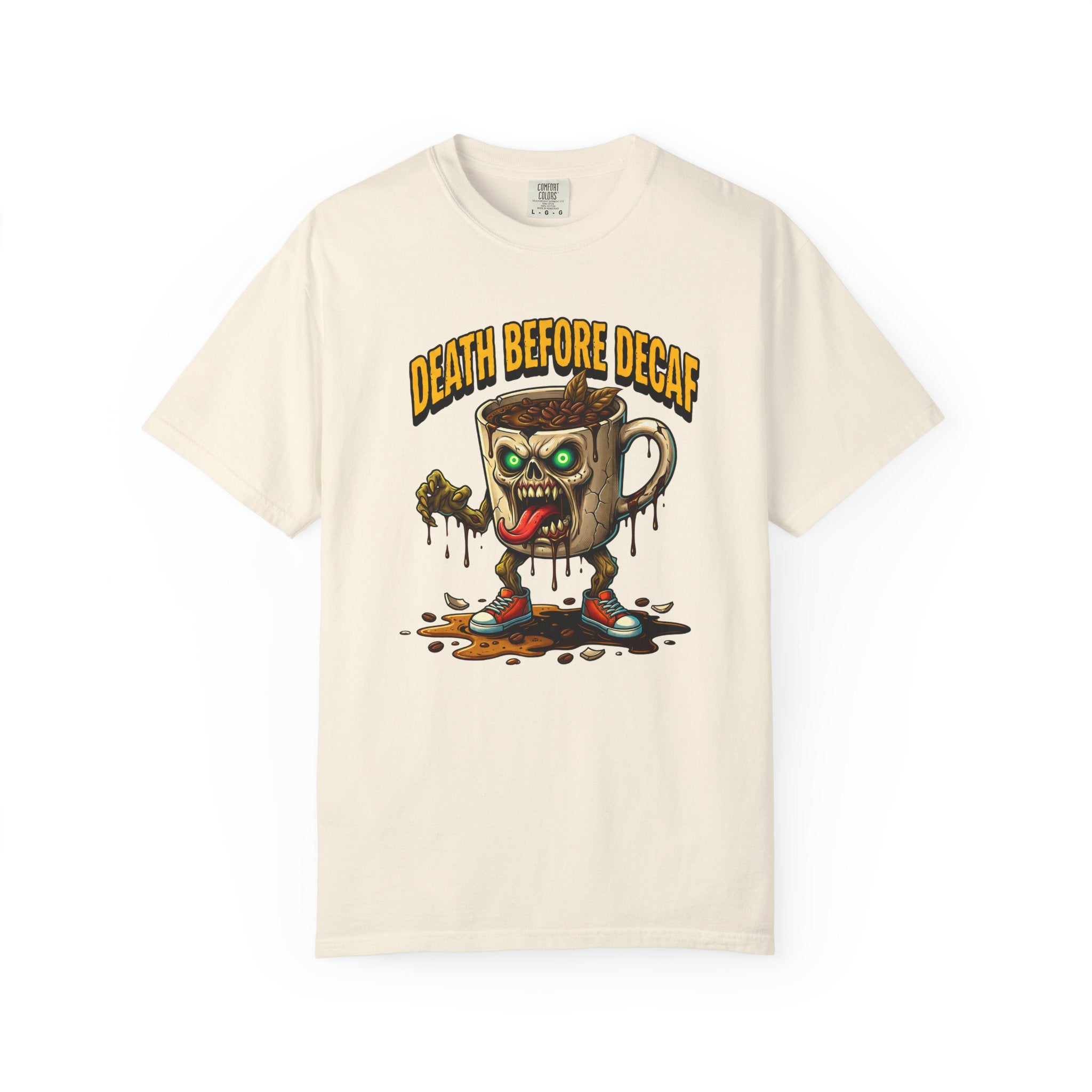 Cream-colored t-shirt with a graphic of a zombie coffee mug character and Death Before Decaf text.