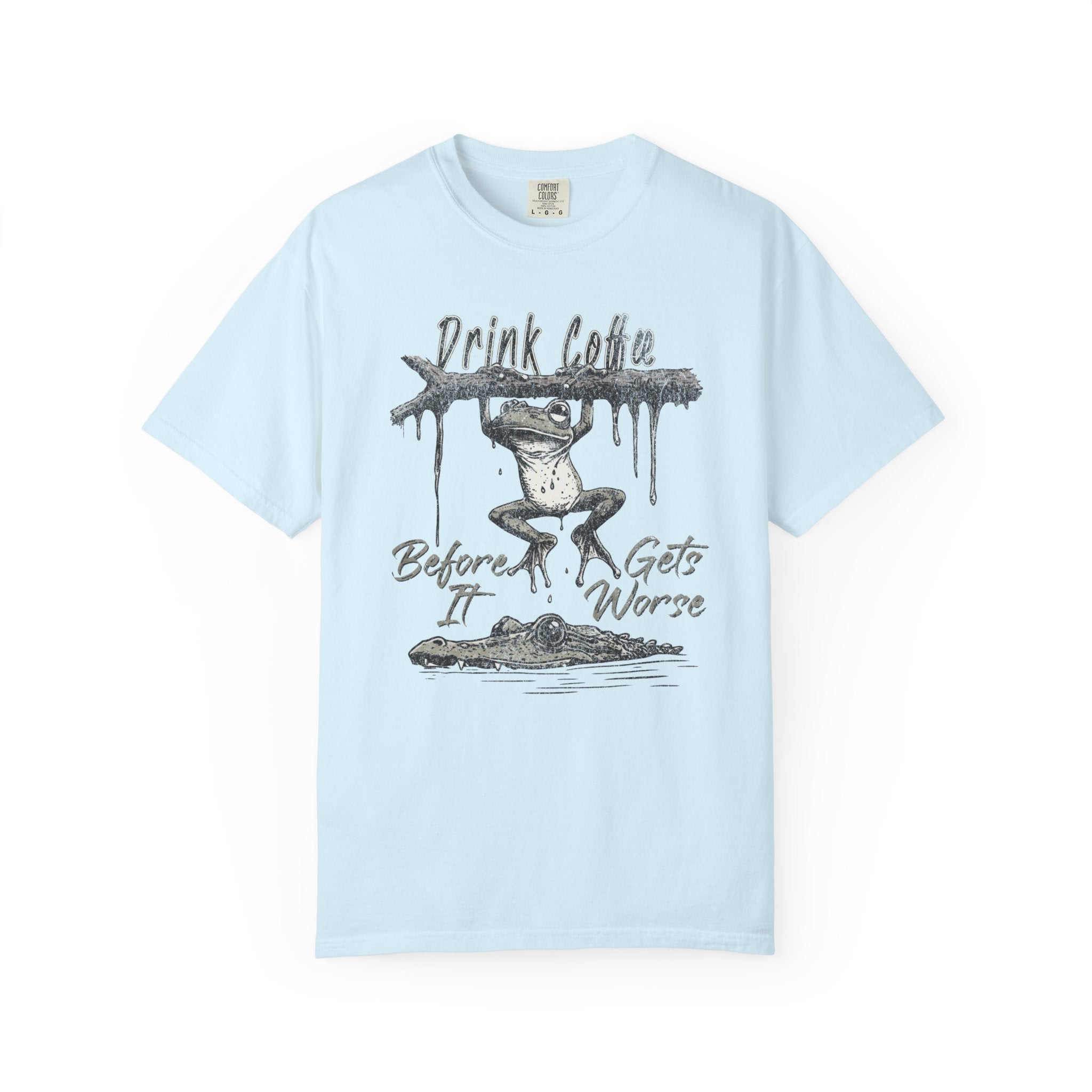 Light blue unisex cotton t-shirt featuring a distressed graphic of a frog hanging over a gator.