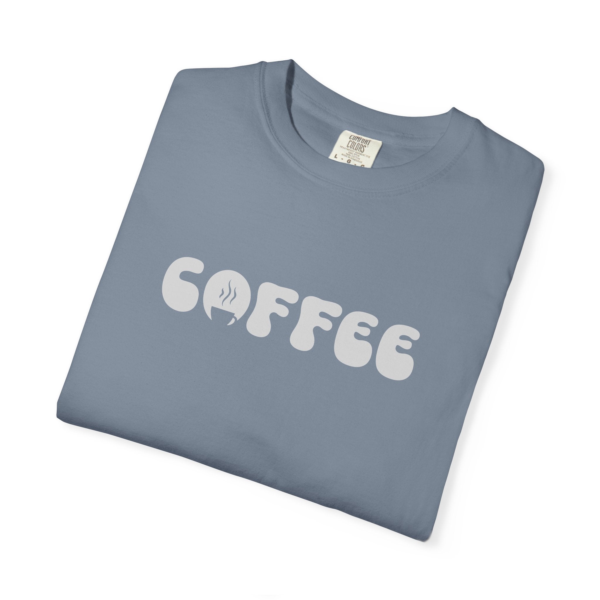 A blue Comfort Colors t-shirt featuring the word COFFEE in a white retro bubble font.