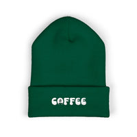 Green cuffed knit beanie with embroidered "COFFEE" text.