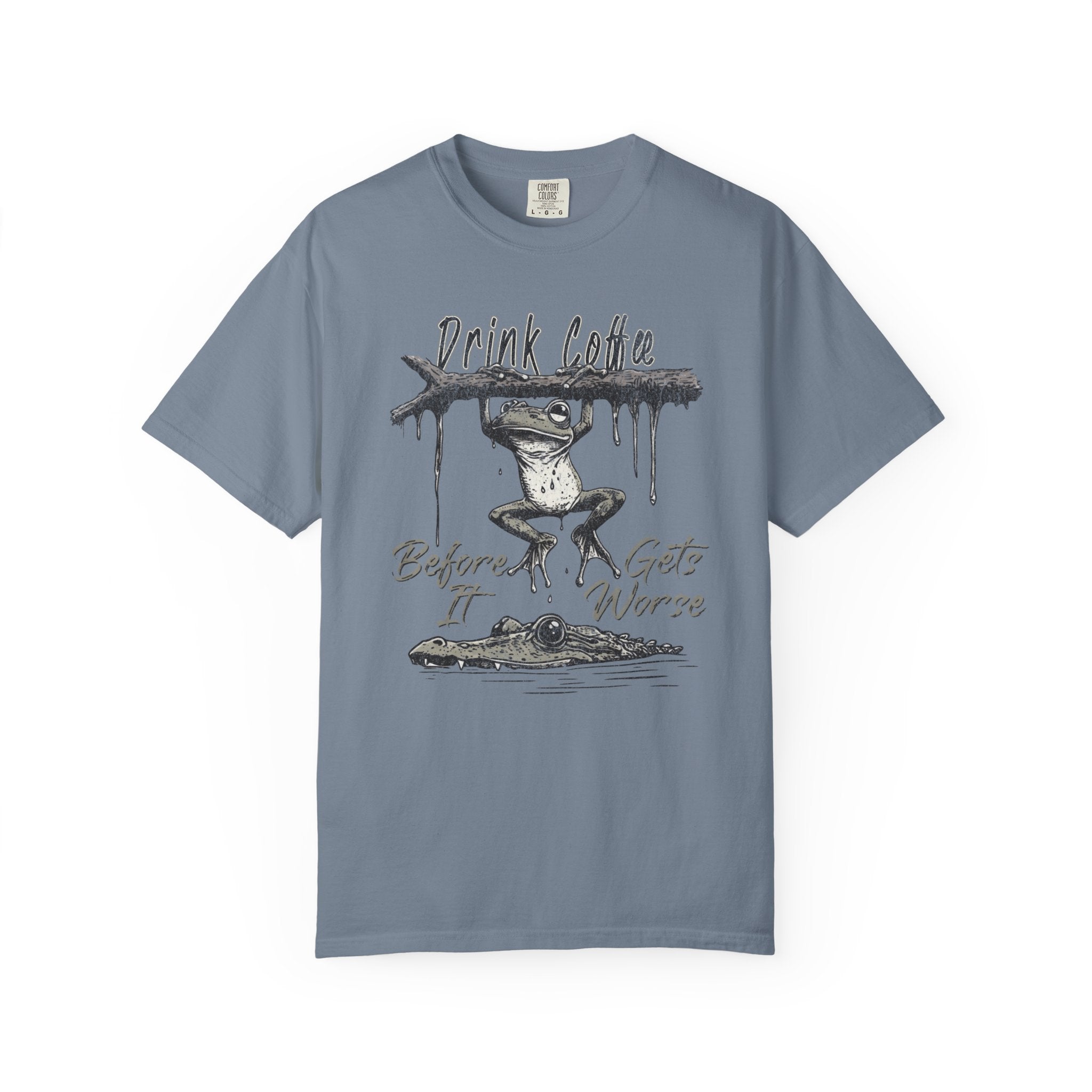 Blue unisex t-shirt with a graphic of a frog hanging from a branch above an alligator.