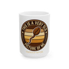 White ceramic coffee mug featuring a coffee bean shaped like a sperm with text about being old.