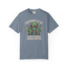 Blue unisex cotton t-shirt featuring a distressed graphic of an alien making peace signs with coffee