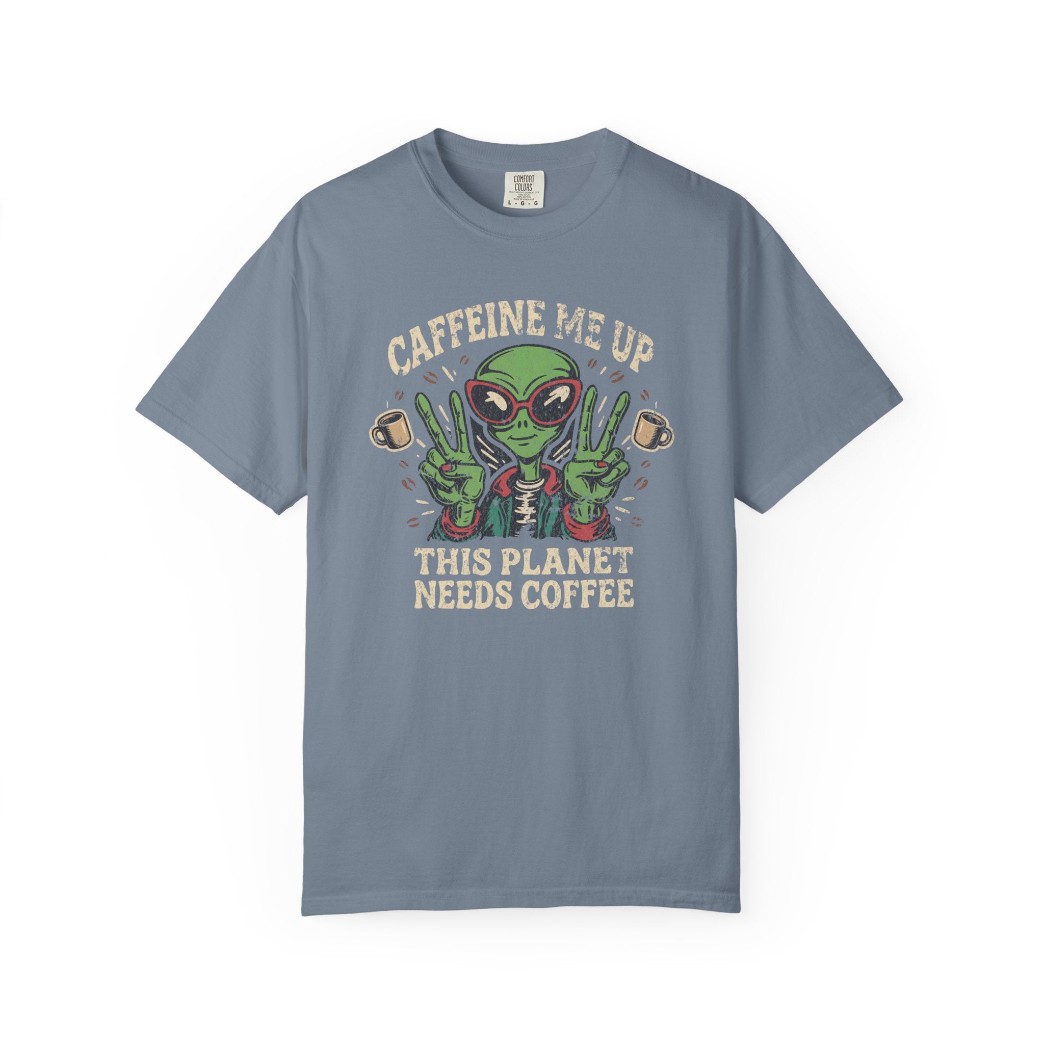 Blue unisex cotton t-shirt featuring a distressed graphic of an alien making peace signs with coffee
