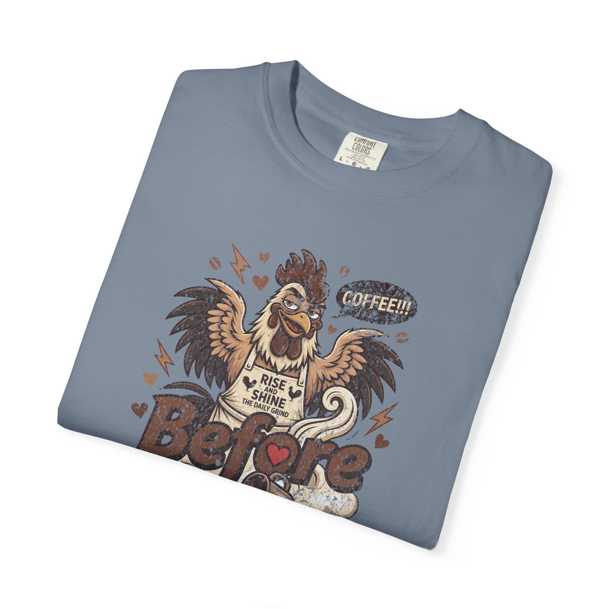 A folded blue unisex cotton t-shirt featuring a distressed graphic of a rooster saying COFFEE!!!