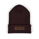 A dark brown cuffed beanie with "COFFEE" embroidered in periodic table style.