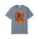 A blue-grey t-shirt featuring a retro, psychedelic graphic that says Decaf Is A Joke.