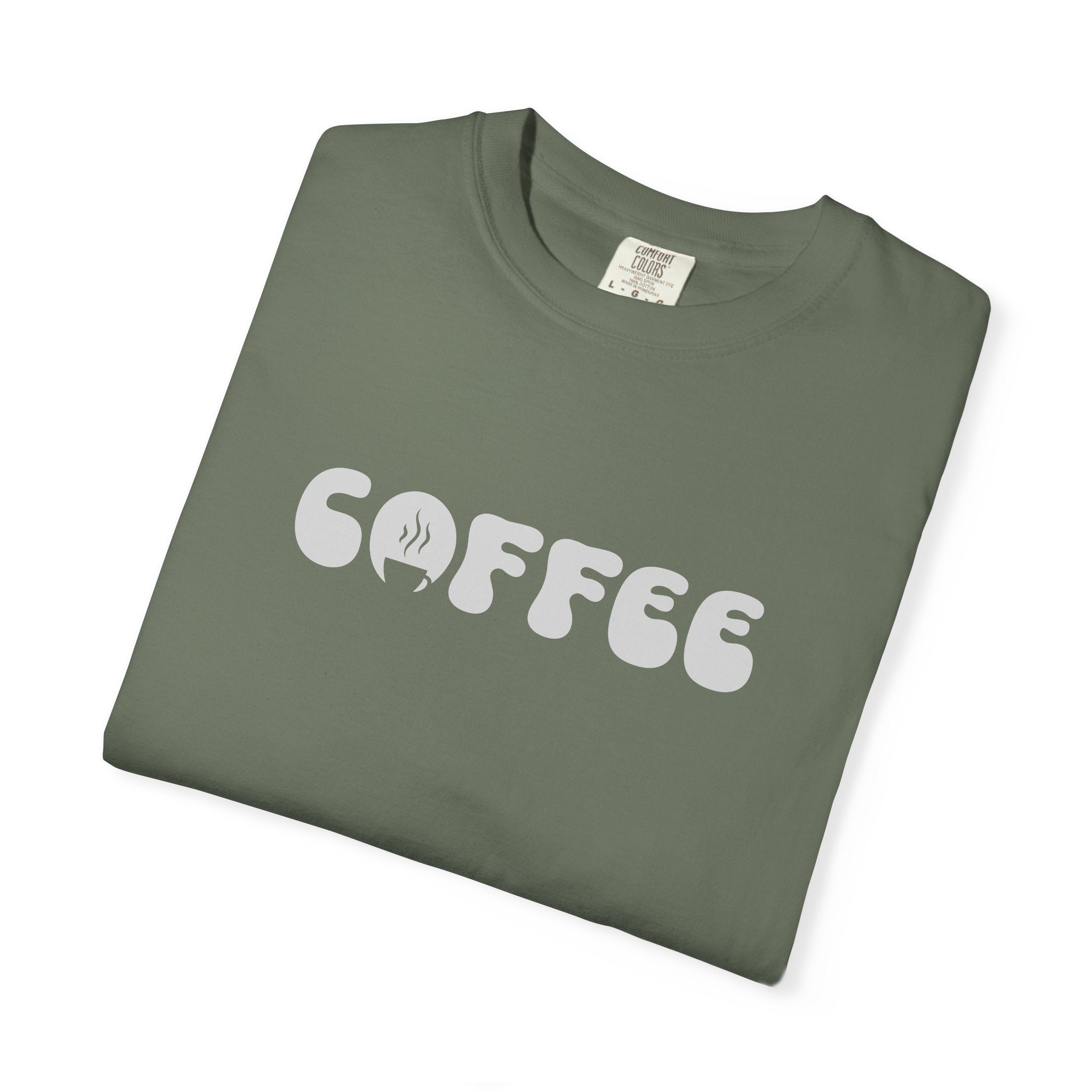A folded olive green cotton t-shirt featuring the word COFFEE in a white retro bubble font.