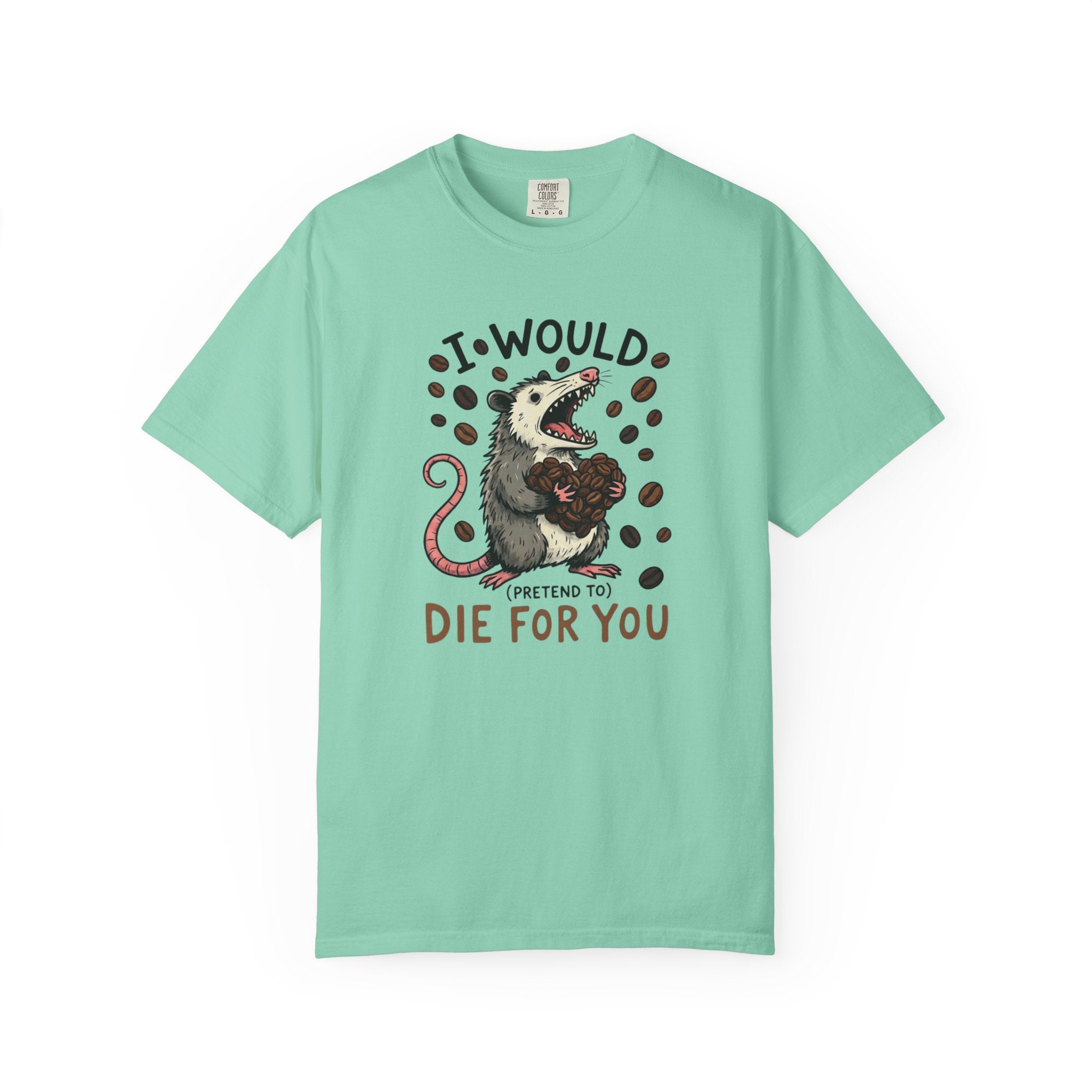 A light green cotton t-shirt featuring a graphic of an opossum holding a heart made of coffee beans.