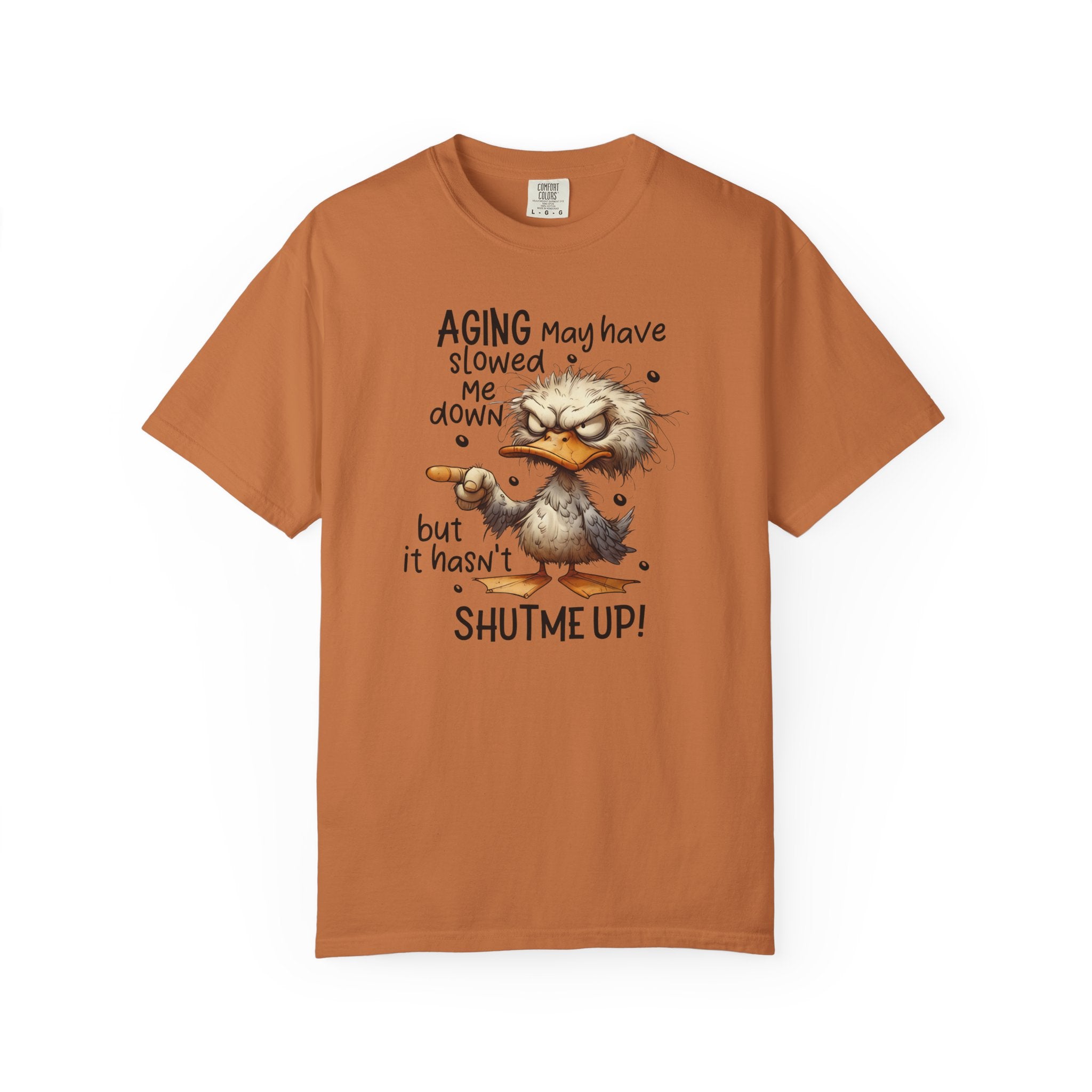 A rust-colored heavyweight cotton t-shirt featuring a grumpy duck graphic and humorous text.