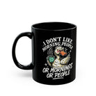 Black 11oz ceramic coffee mug featuring a grumpy duck illustration and text about hating mornings.