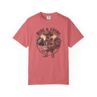 A red t-shirt featuring a graphic of a cowboy rooster pouring coffee into a mug.