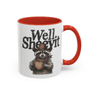 White ceramic mug with a red handle and rim, featuring a raccoon in a cowboy hat holding a mug.