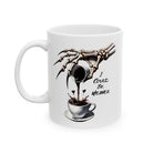 White ceramic mug with a skeleton hand pouring coffee into a cup, with text "I Could Be Meaner".