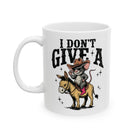 White ceramic coffee mug featuring a cartoon mouse in a cowboy hat riding a donkey.