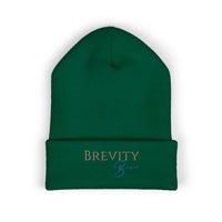 A green cuffed beanie with "Brevity Brew" embroidered on the front.