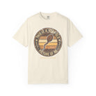Cream-colored t-shirt with a vintage-style graphic of a coffee bean shaped like a sperm cell.