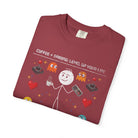 A maroon unisex cotton t-shirt featuring a distressed graphic of a stick figure with coffee and game