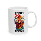 A white ceramic mug featuring a colorful, wide-eyed, frazzled chicken and the text Coffee Addict.