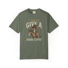Olive green t-shirt with a distressed graphic of a cowboy rat riding a donkey holding coffee.