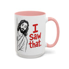 White ceramic mug with a pink handle and interior, featuring a drawing of Jesus saying I Saw that.