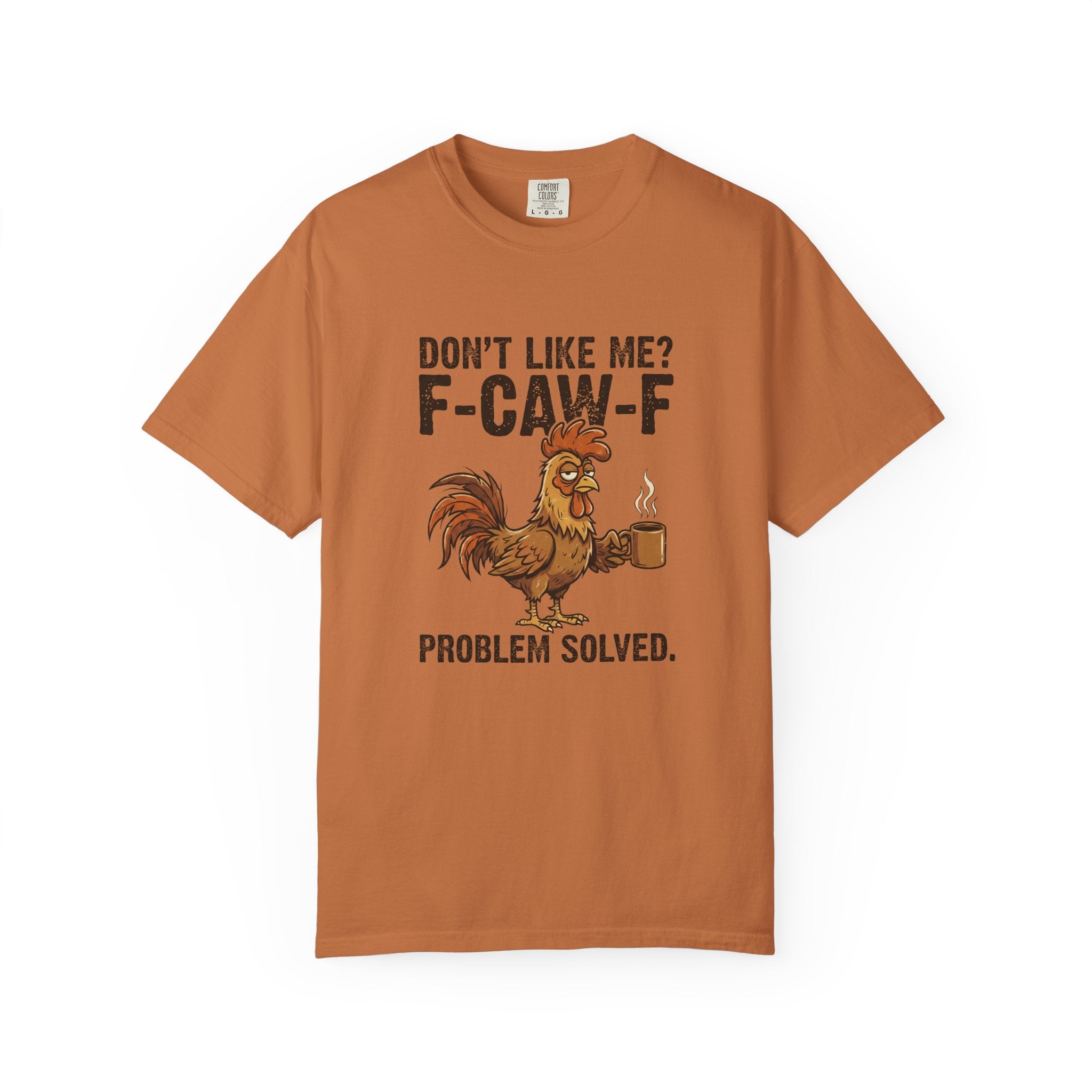 A rust-colored t-shirt featuring a graphic of a rooster holding a coffee mug with witty text.
