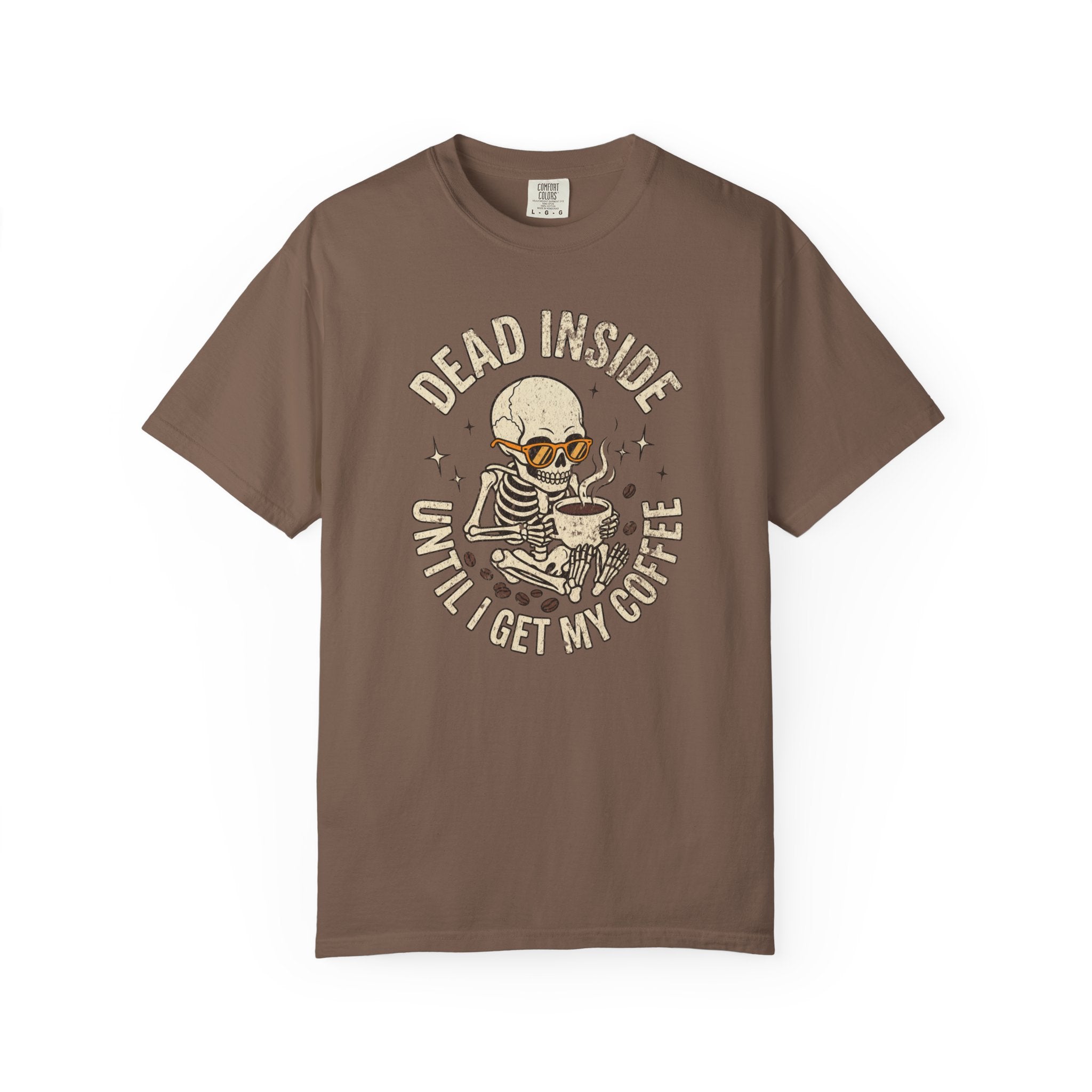Brown t-shirt with a distressed graphic of a skeleton wearing sunglasses and drinking coffee.