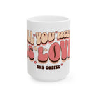 A white ceramic mug featuring retro bubble lettering that reads All You Need Is Love and Coffee.