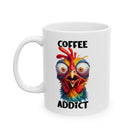 A white ceramic mug featuring a colorful, wide-eyed, frazzled chicken and the text Coffee Addict.