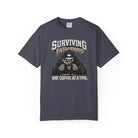 Dark grey unisex t-shirt with a skeleton graphic drinking coffee and text Surviving Fatherhood.