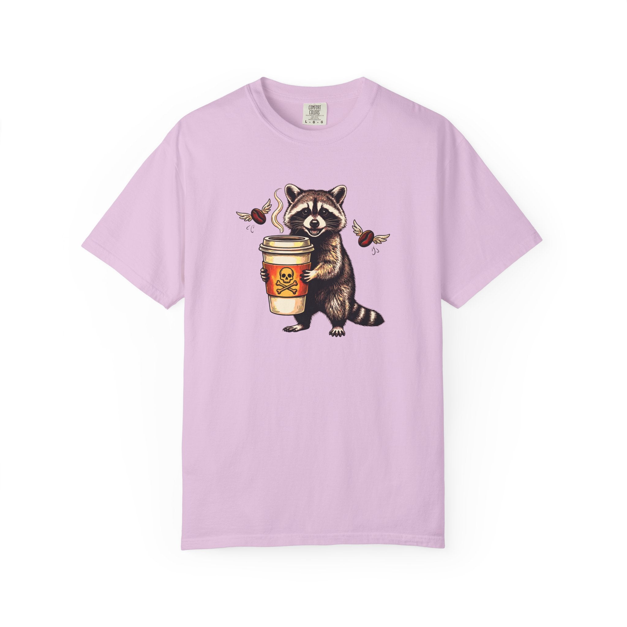 Light purple Comfort Colors unisex t-shirt featuring a raccoon holding a coffee cup with a skull.