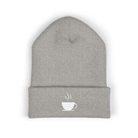 A gray knit beanie with a white embroidered coffee cup and steam.