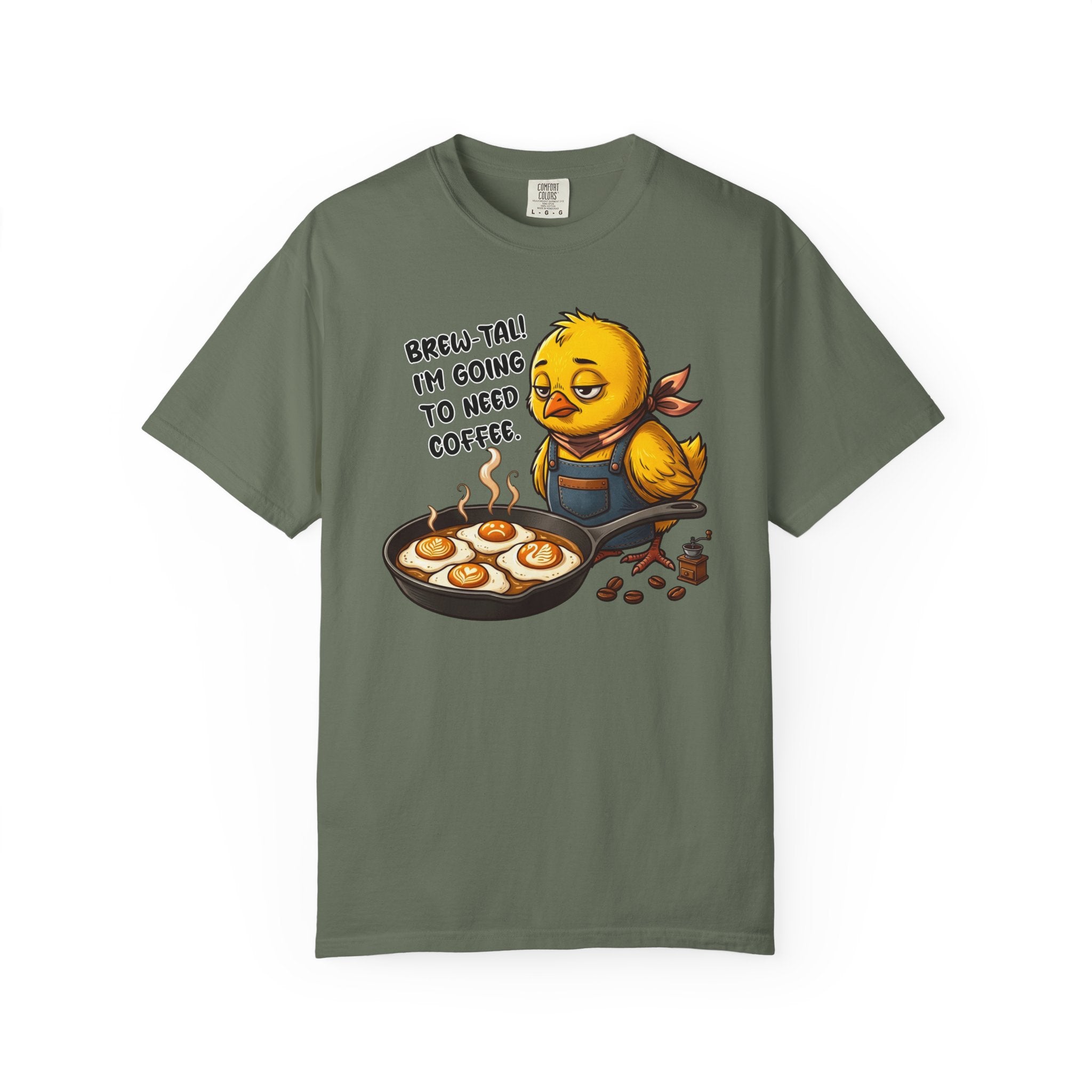 Olive green t-shirt featuring a sleepy chick in an apron with a pan of coffee-themed fried eggs.