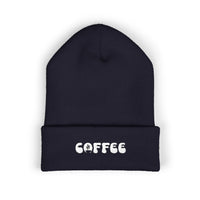 A navy blue cuffed beanie with white embroidered "COFFEE" text.
