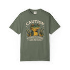 Olive green t-shirt featuring a frog graphic with the text Caution Without Coffee I Have No Filter.