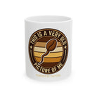 White ceramic coffee mug featuring a coffee bean shaped like a sperm with text about being old.