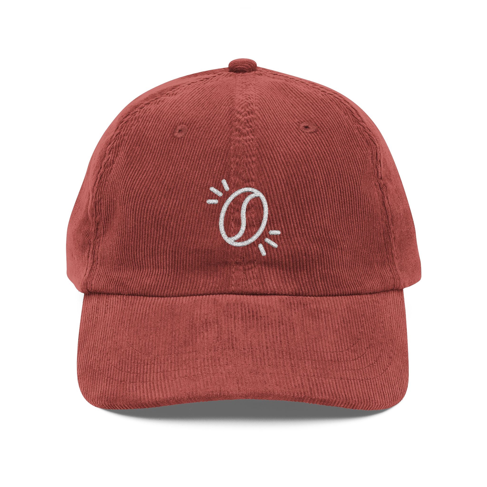 A rust-colored corduroy dad hat featuring an embroidered white coffee bean icon on the front.