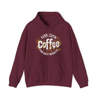 A maroon hooded sweatshirt featuring a white and gold graphic that says Fill With Coffee For Best Results.