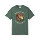 Green t-shirt featuring a graphic of a lion wearing a bandana with the text Powered by Coffee.