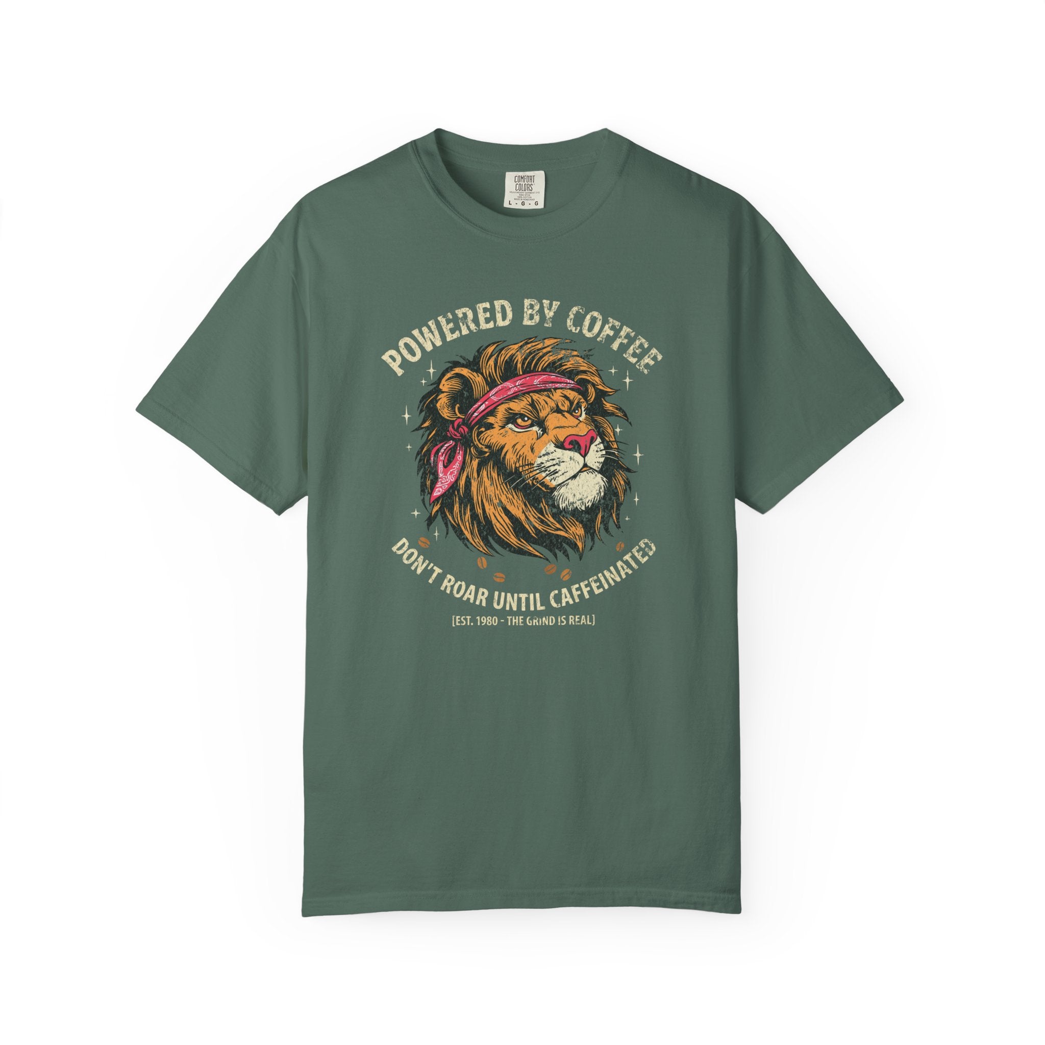 Green t-shirt featuring a graphic of a lion wearing a bandana with the text Powered by Coffee.
