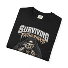 Black Comfort Colors t-shirt featuring a skeleton wearing a cap and hoodie, holding a DAD mug.