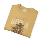 Mustard yellow t-shirt with a distressed graphic of a mouse in a cowboy hat riding a donkey.