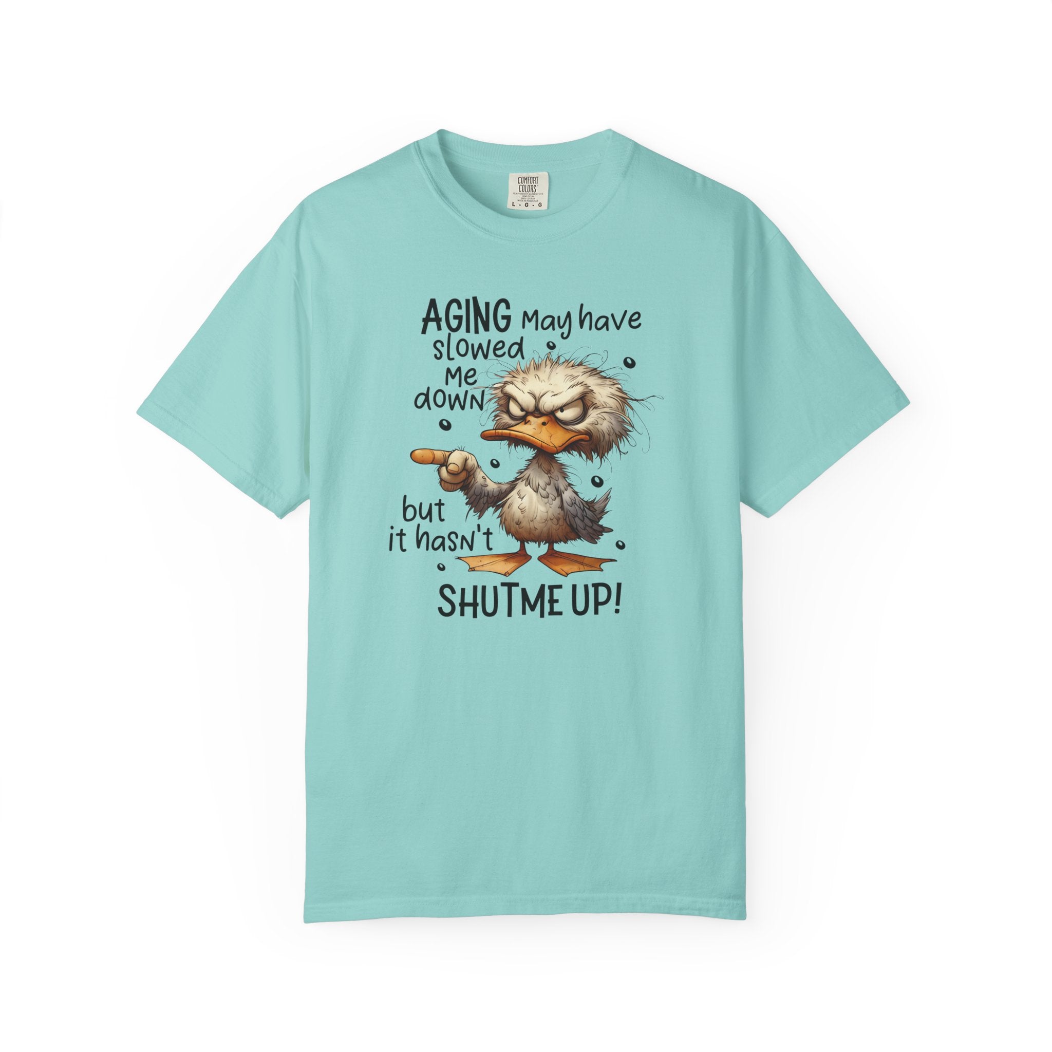 A light blue t-shirt featuring a grumpy cartoon duck pointing with the text about aging.