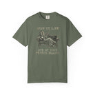 Olive green Comfort Colors 1717 t-shirt with a vintage graphic of a coffee bean lounging on a sofa.