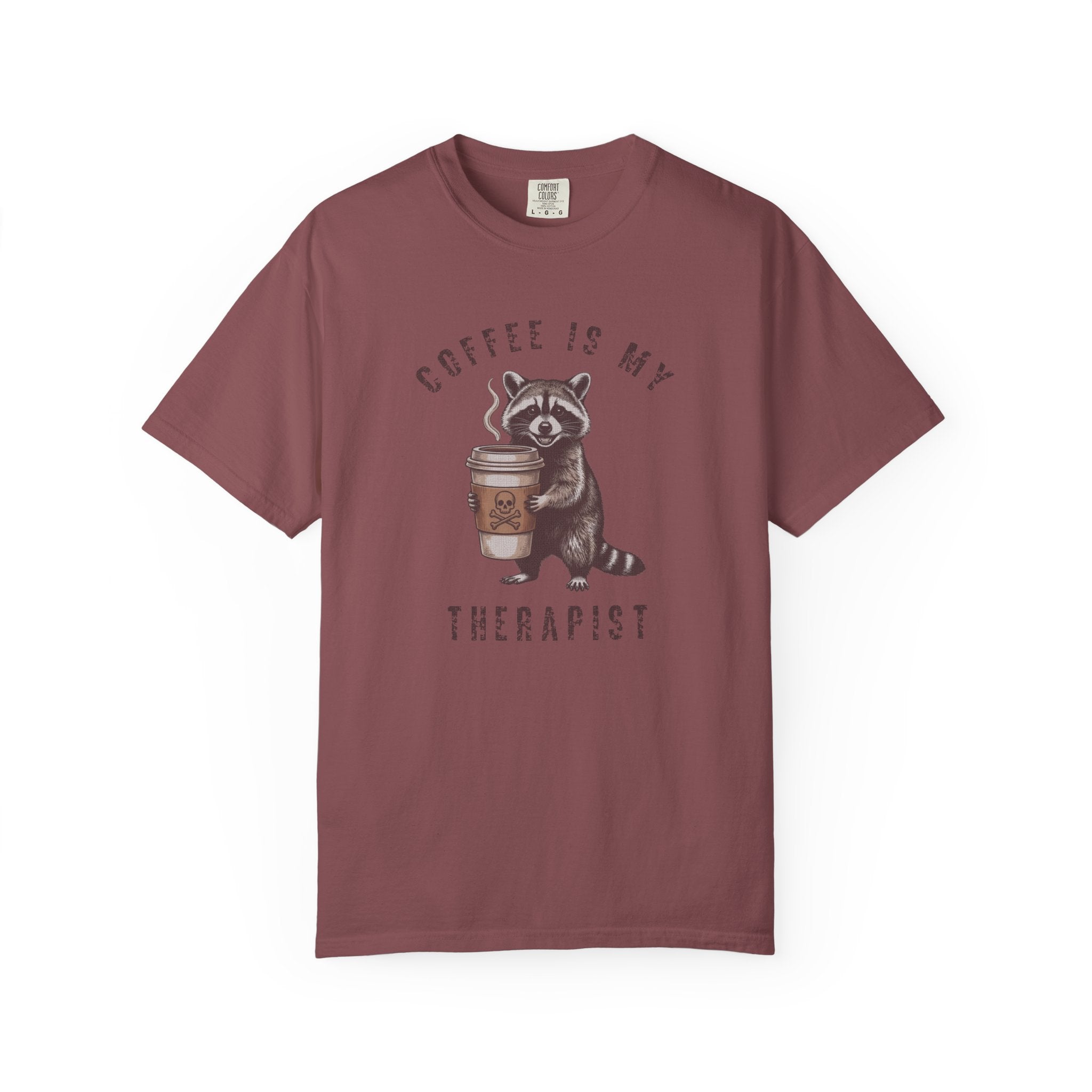 Maroon unisex cotton t-shirt featuring a raccoon holding a coffee cup with a skull design.