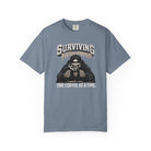 Blue-grey Comfort Colors unisex t-shirt with a skeleton graphic drinking coffee.