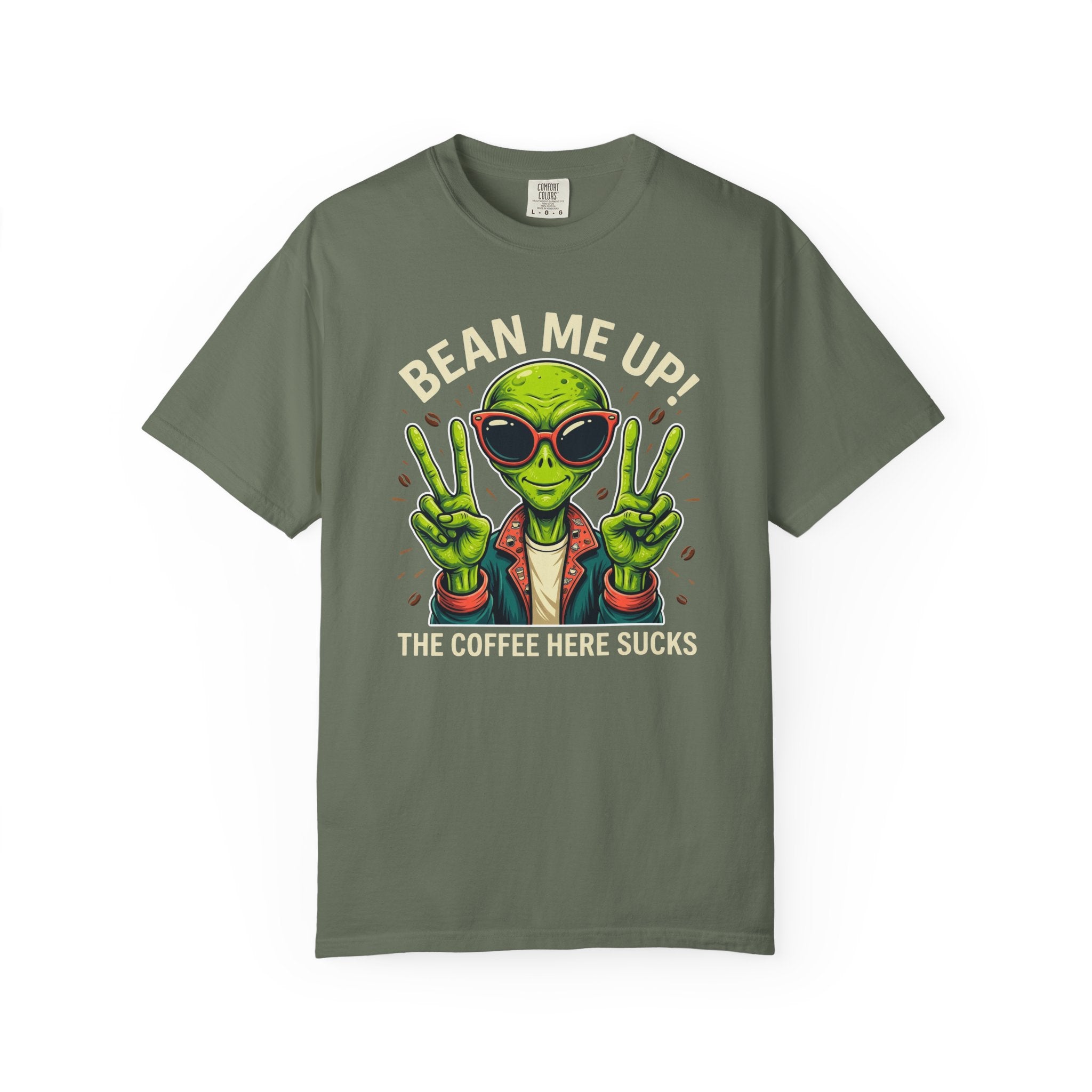 Olive green t-shirt featuring a graphic of an alien wearing sunglasses and making peace signs.